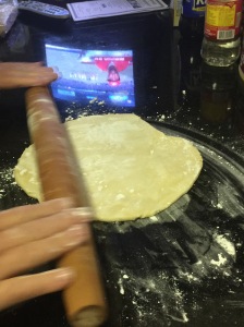 Make putting the pie dough easy by first rolling it on your rolling pin!